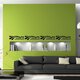 A green wall creatively decorated with signage vinyl, featuring intricate designs, inspiring quotes, or thematic elements, enhancing the aesthetic appeal and ambiance of the space.